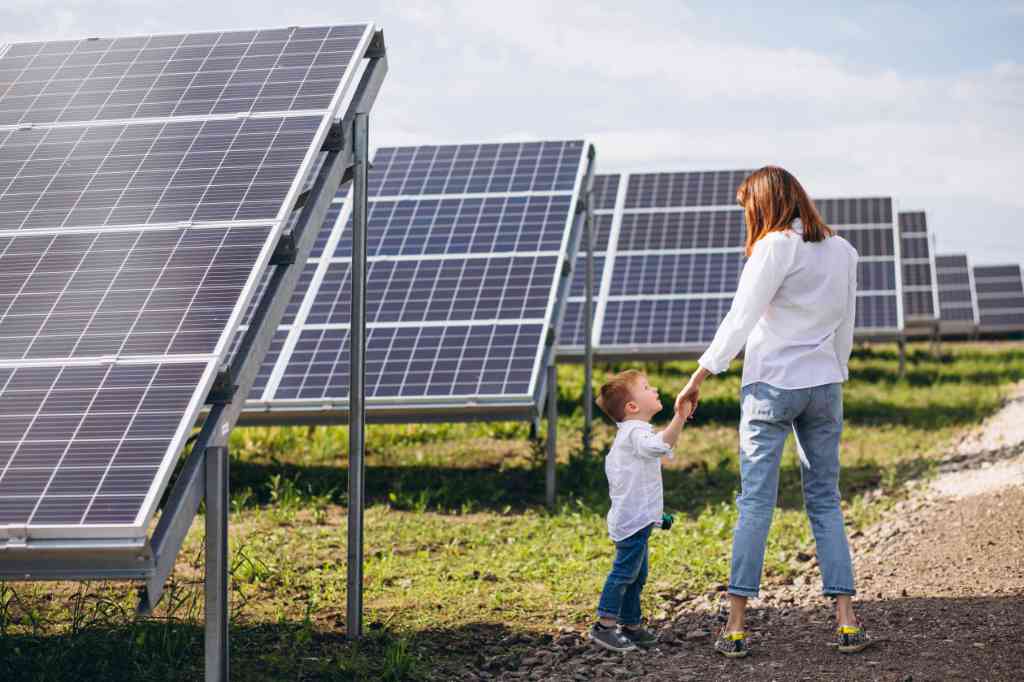 mother-with-her-little-son-by-solar-panels